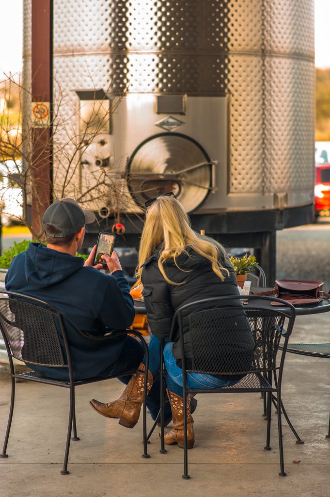 Guests relaxing with wine at Dono dal Cielo